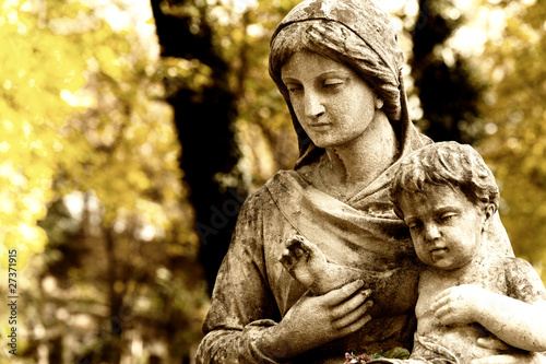 Monument of the woman with the child on a cemetery