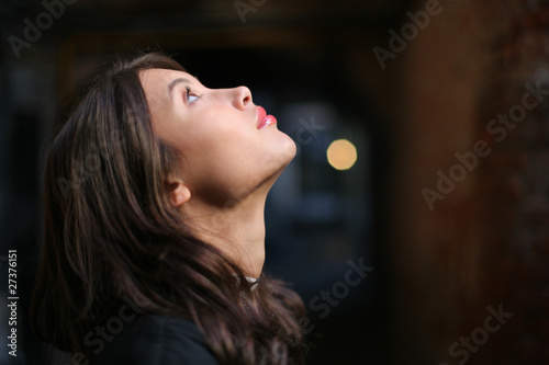 Woman looking up in faith, dreaming a dream photo