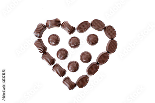 Chocolates in love shape isolated on white