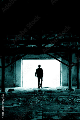 Silhouette man in ruined place
