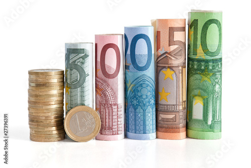 euro rolled bills and coin - euro monete e banconote