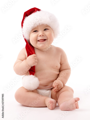 Little child wearing red Christmas cap