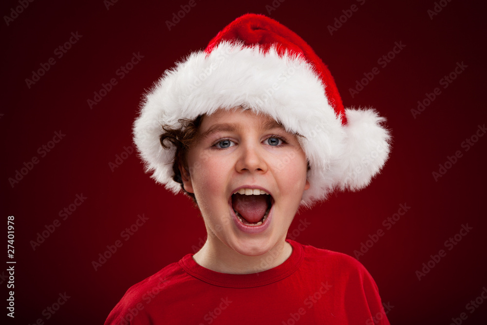 Christmas time - boy with Santa Claus Hat Christmas time - boy with Santa Claus Hat