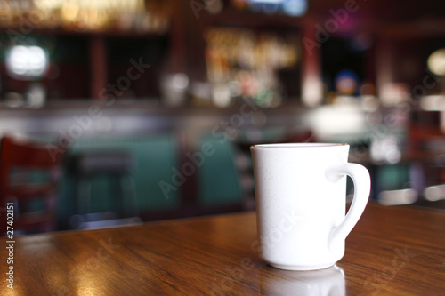 Coffee mug on table at a restaurant bar