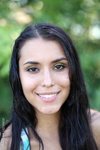 Portrait young caucasian woman outdoors freckles