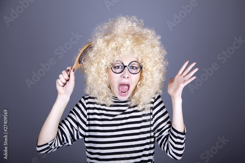 Portrait of feared girl with comb.