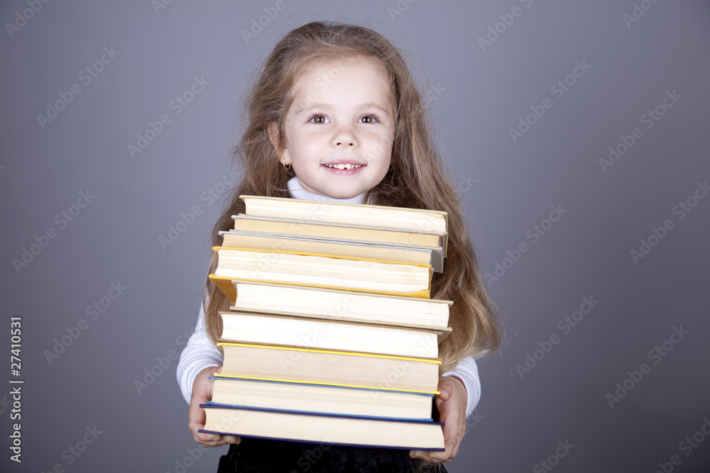 Little schoolgirl with books.