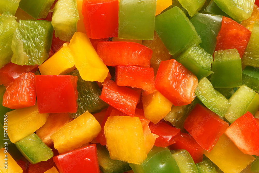 Slices of green, yellow and red bell pepper Slices of green, yellow and red bell pepper