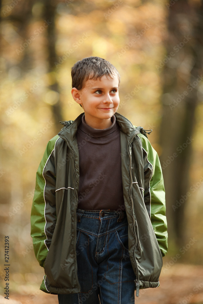 Boy walking through forest Boy walking through forest