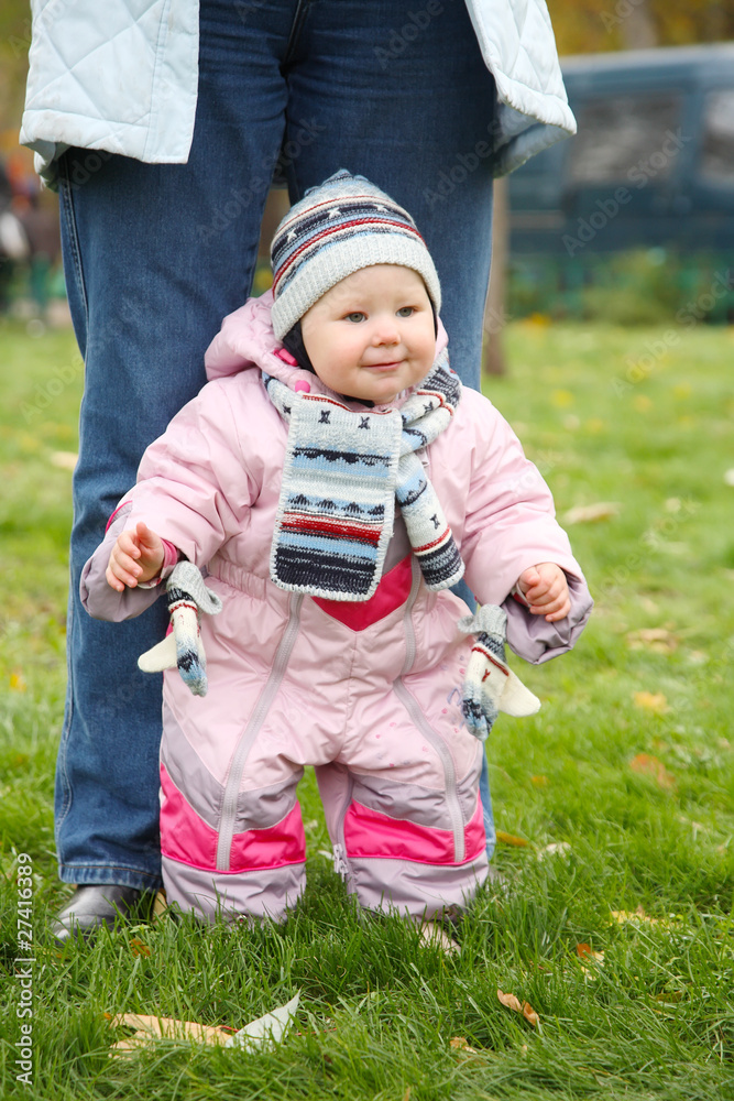 little girl in pink overalls learns to walk little girl in pink overalls learns to walk