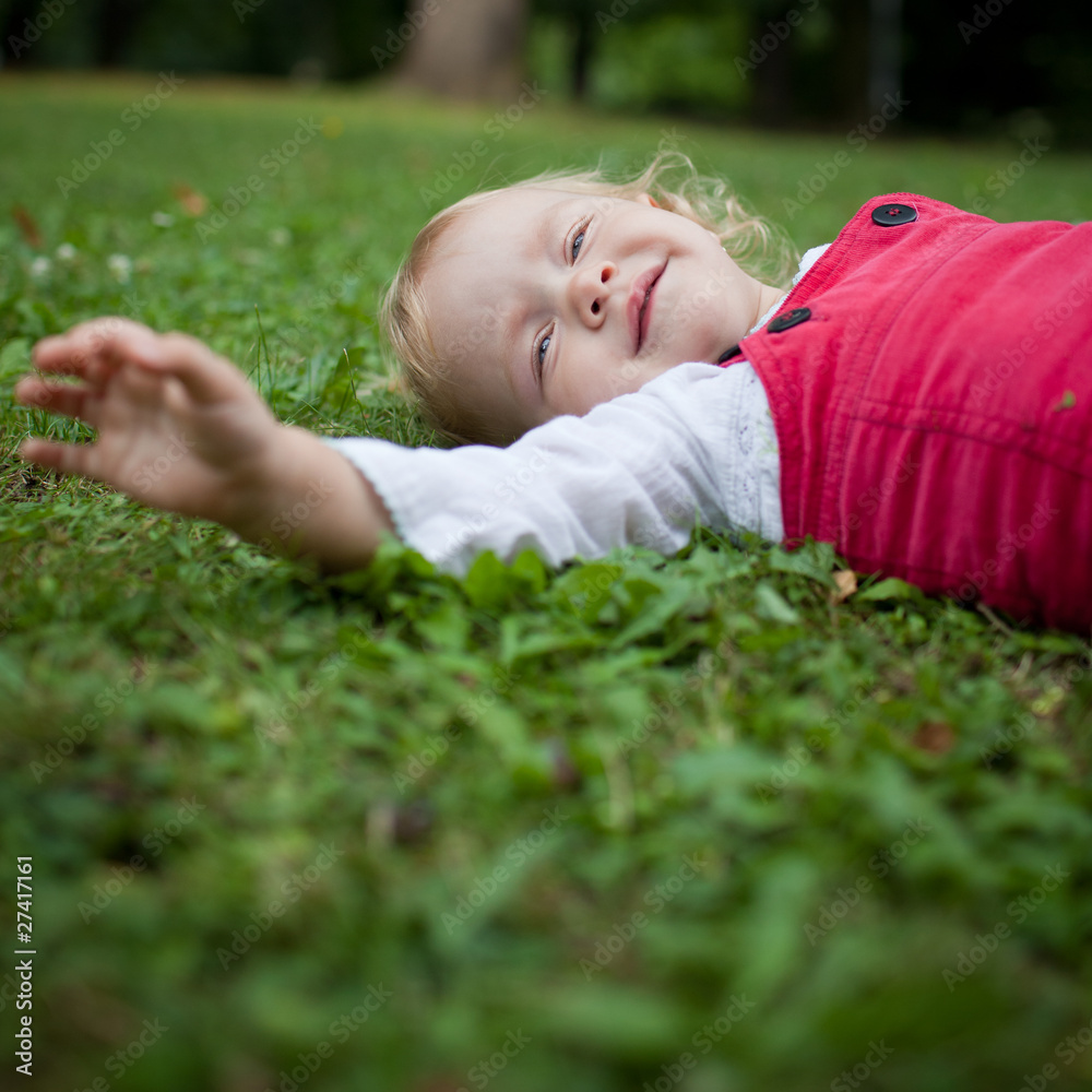 cute little girl outdoors in a park cute little girl outdoors in a park
