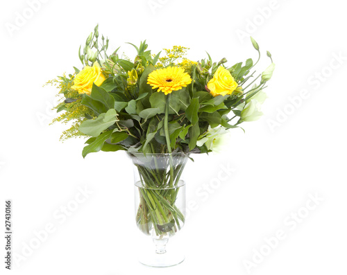 Bouquet of yellow flowers in vase over white background © Sandra van der Steen
