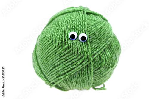 skein of wool with eyes isolated on white