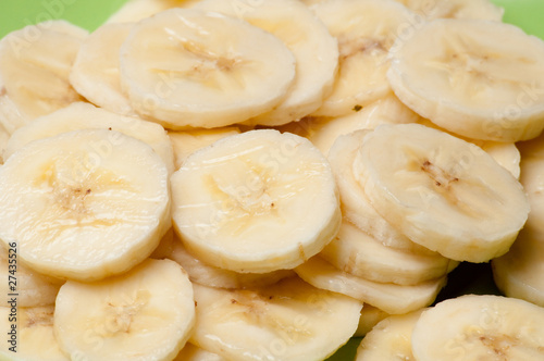 Freshly sliced bananas on a white background