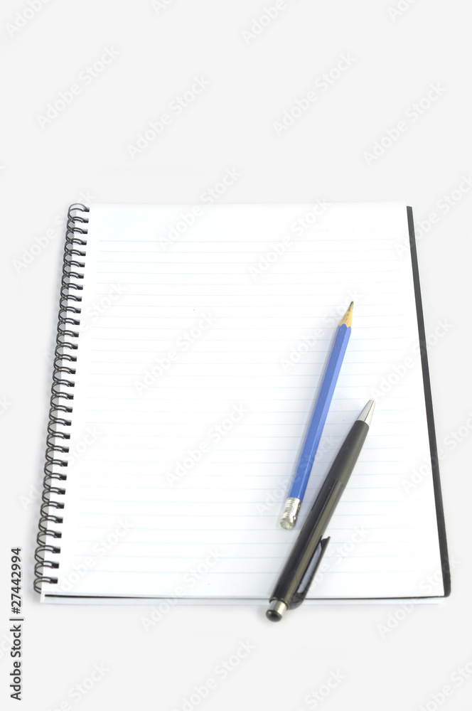 Empty spiral notebook with pencil and pen Empty spiral notebook with pencil and pen