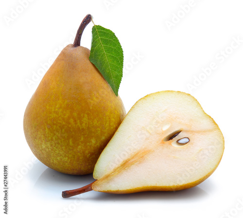 Yellow sliced pears with green leaf isolated