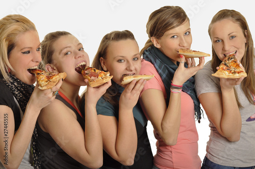 Girls are eating pizza
