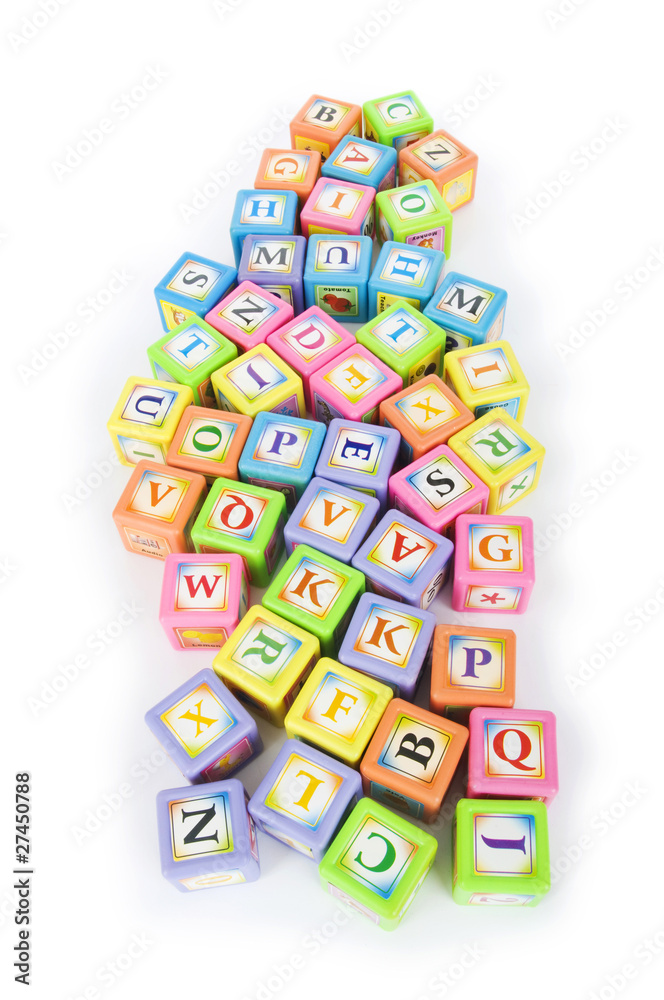 Learning and education concept - pile of alphabet blocks Learning and education concept - pile of alphabet blocks