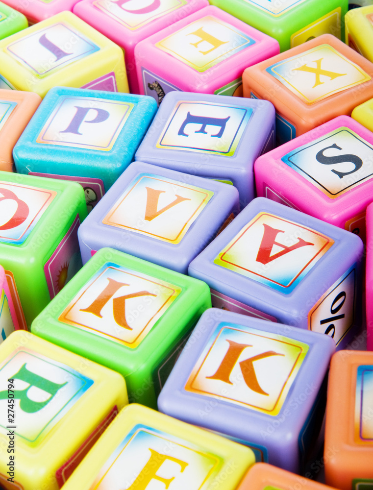 Learning and education concept - pile of alphabet blocks Learning and education concept - pile of alphabet blocks