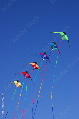 Kites against a vivid blue sky