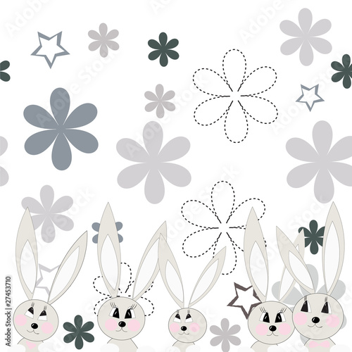 Gray rabbits on a flower glade