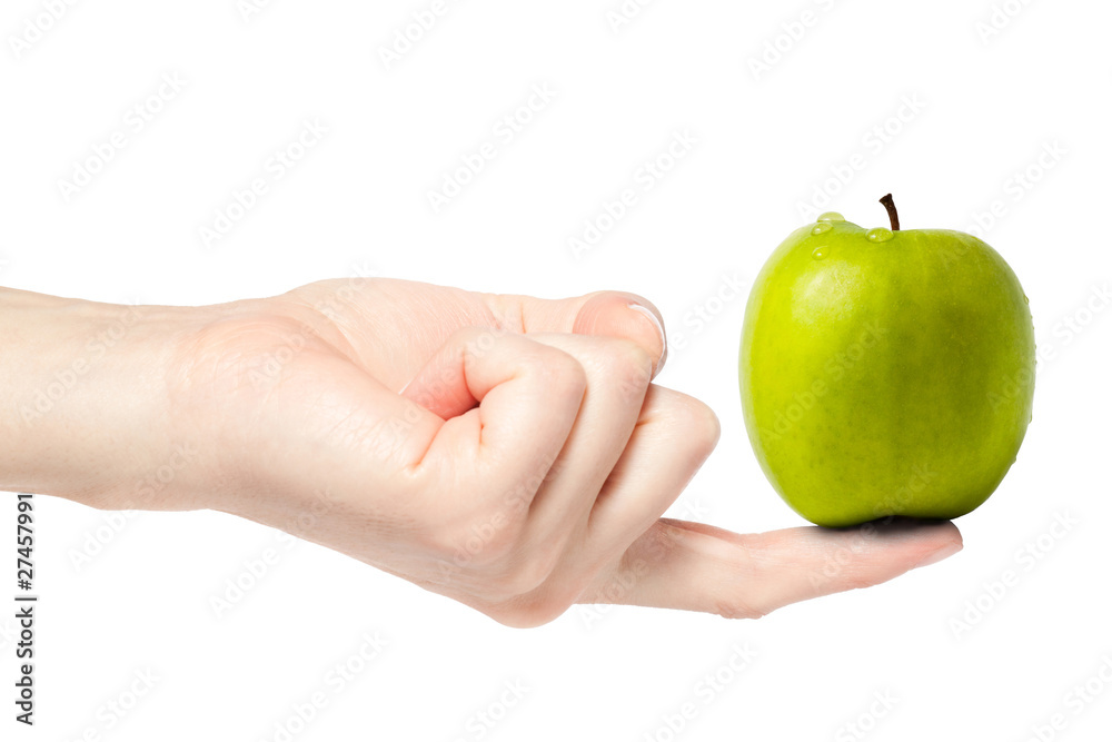 Female hand balancing a fresh wet green apple on finger, Female hand balancing a fresh wet green apple on finger,