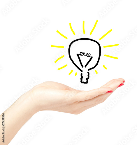 Beautiful female hand holding up a drawn light bulb