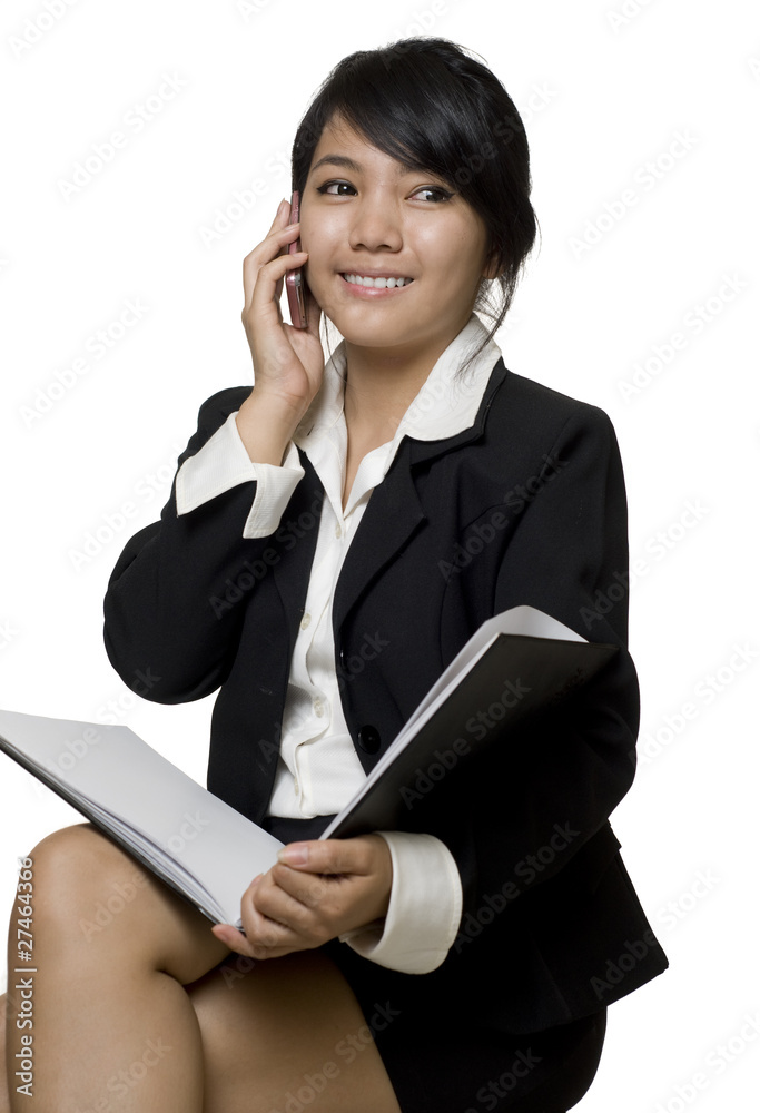 Asian businesswoman talking on the telephone Asian businesswoman talking on the telephone