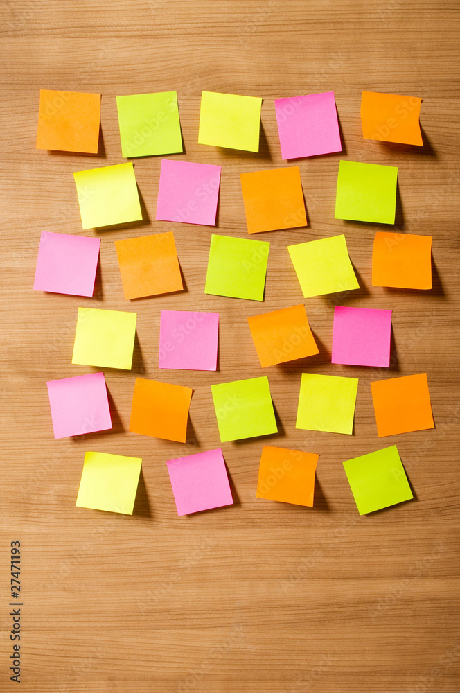 Fototapeta premium Many reminder notes on the wooden background