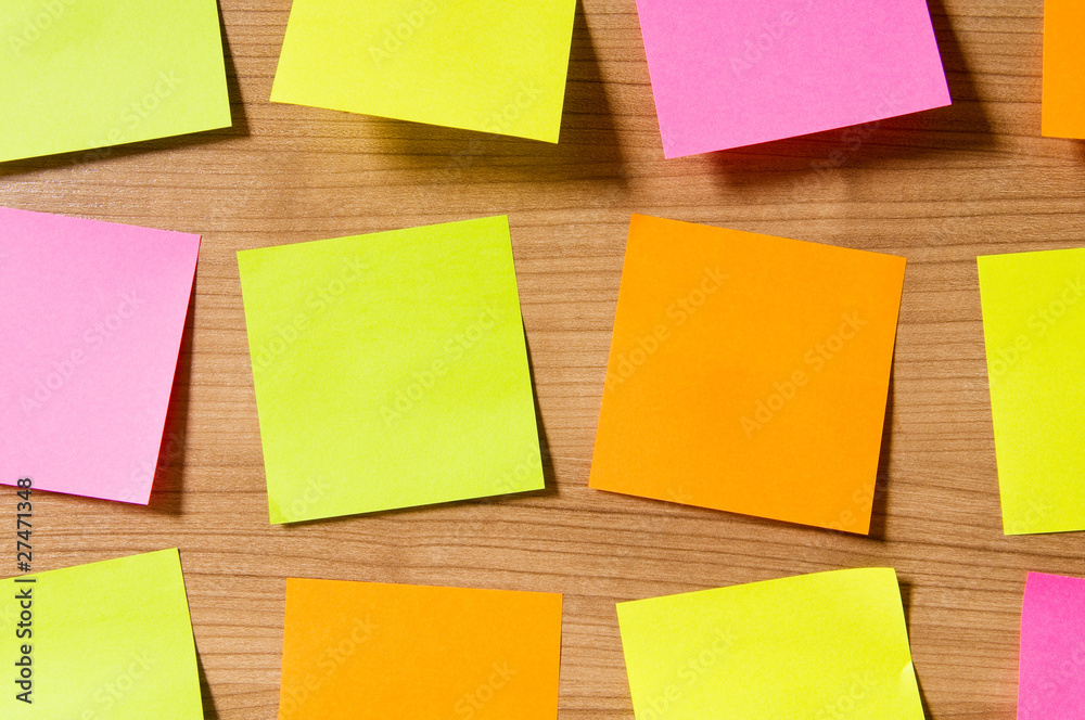 Many reminder notes on the wooden background Many reminder notes on the wooden background