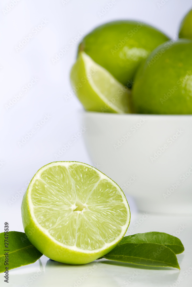 Lime with bowl of limes Lime with bowl of limes