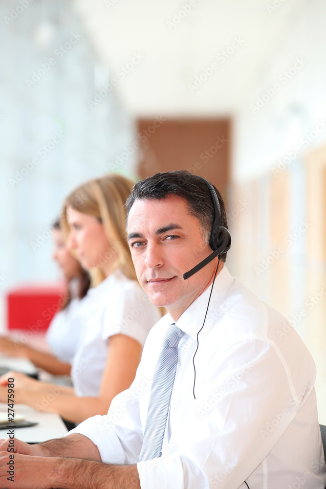 Fototapeta premium Business people working in front of computer with headphones