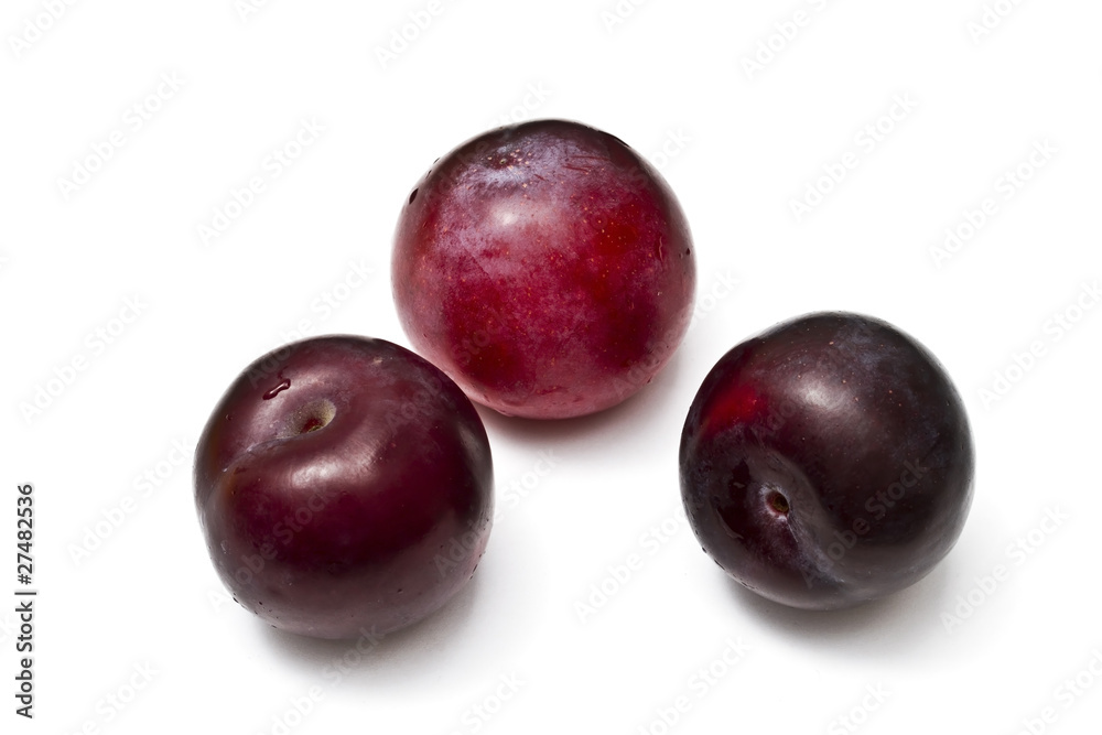 Plums isolated on white