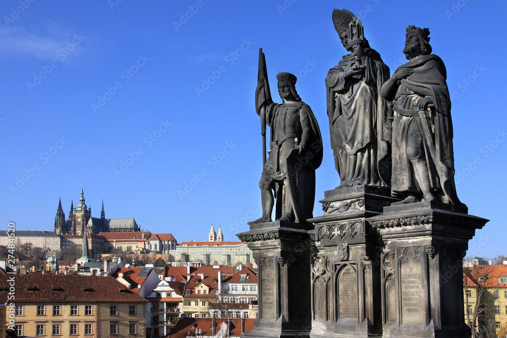 Statues on the Charles Bridge with Prague Castle