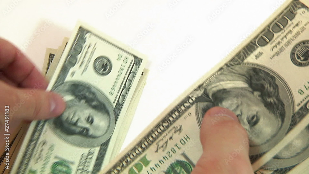 man counting dollars on white background