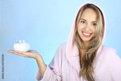 Young woman with cream after bath