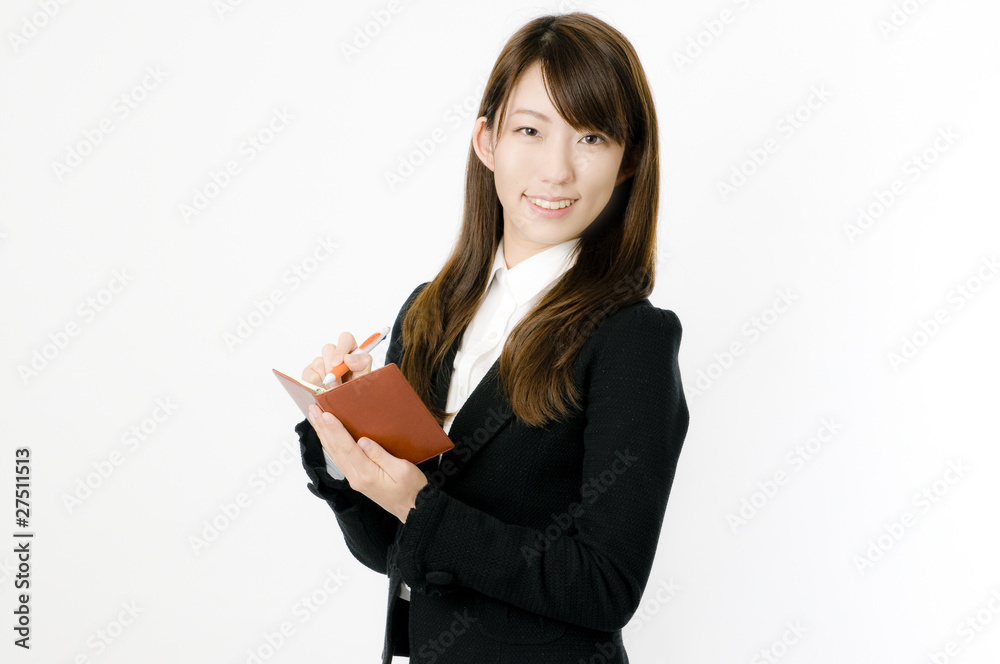 メモを取る女性社員 メモを取る女性社員