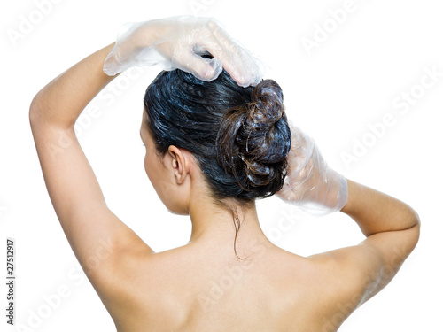 rear view of woman dyeing hairs -isolated