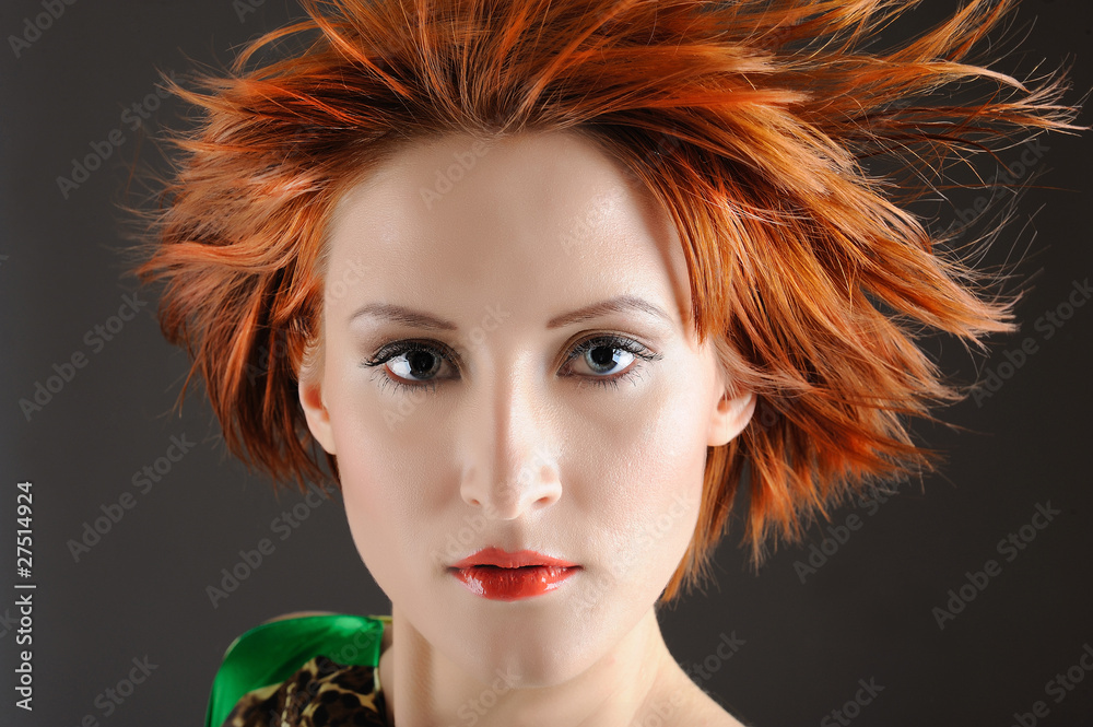Fototapeta premium Beauty portrait of pretty woman with healthy red flying hair, pu