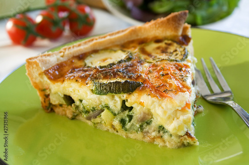A sliced portion of Zucchini quiche on a plate