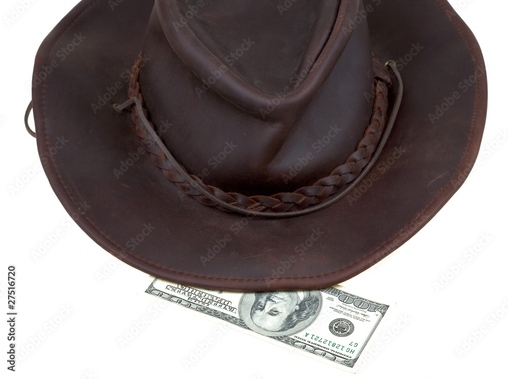Cowboy hat and 100 dollar bill Stock Photo | Adobe Stock