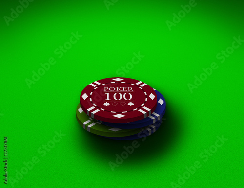 Poker chips close up on a green table