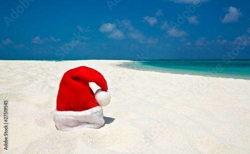 Santa hat is on a beach