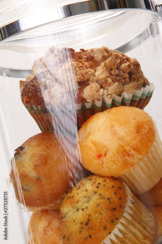 Muffins and cupcakes in airtight container photo