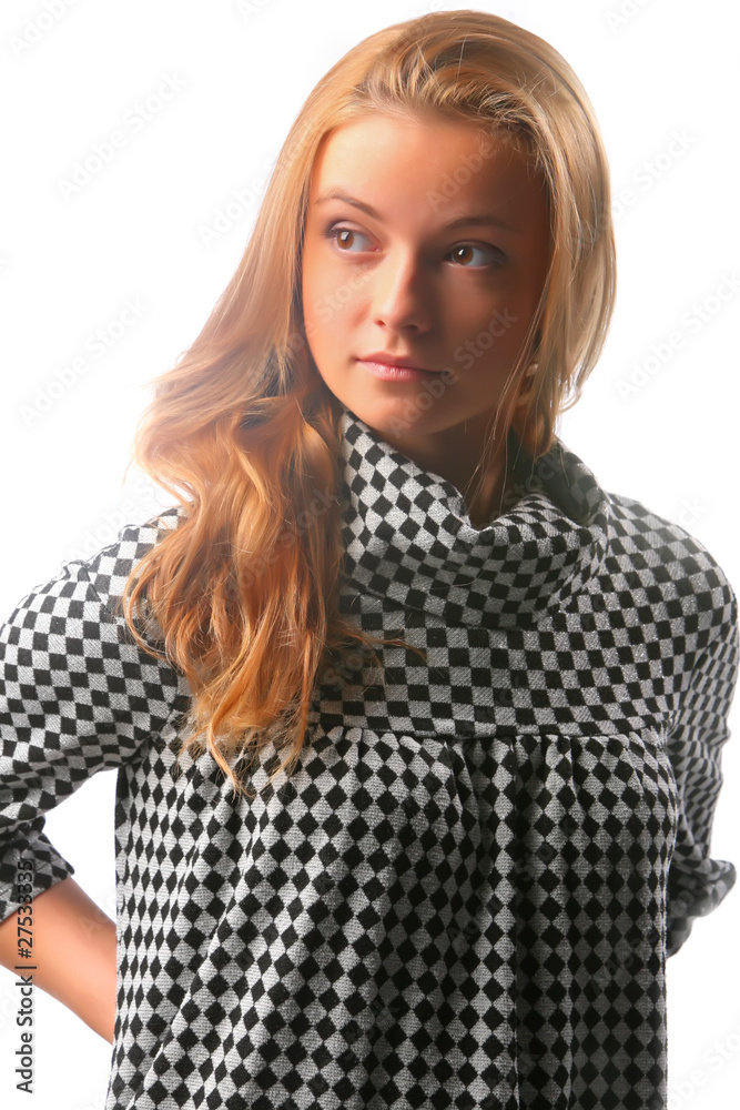 Blonde girl in a checkered dress on a white background Blonde girl in a checkered dress on a white background
