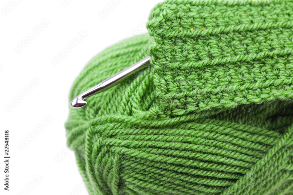 Fototapeta premium Skein of wool, crochet hook and knitted piece isolated on white