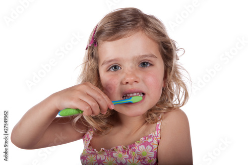 Young girl brushing her teeth