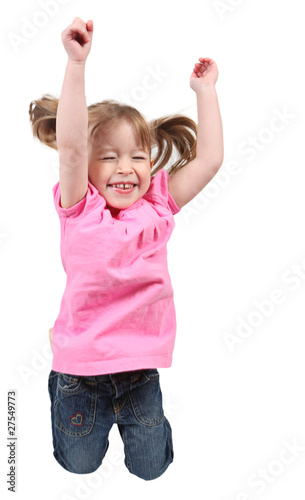 Adorable little girl jumping in air.