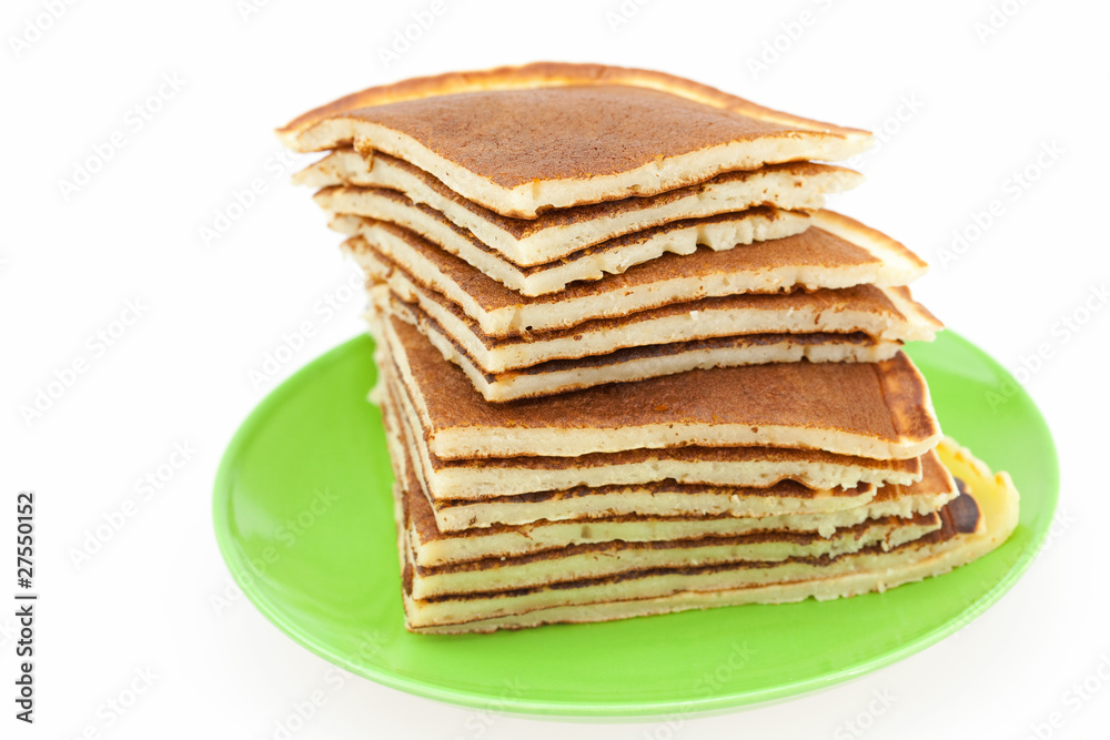 Pancakes on a plate isolated on white Pancakes on a plate isolated on white