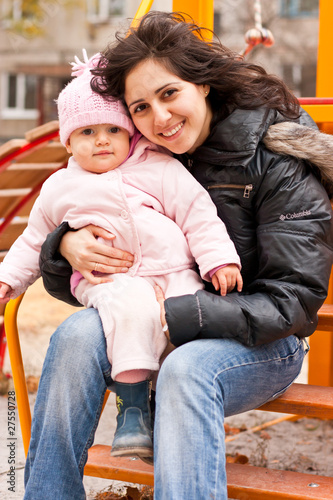 Mother and daughter outdoor on a playground